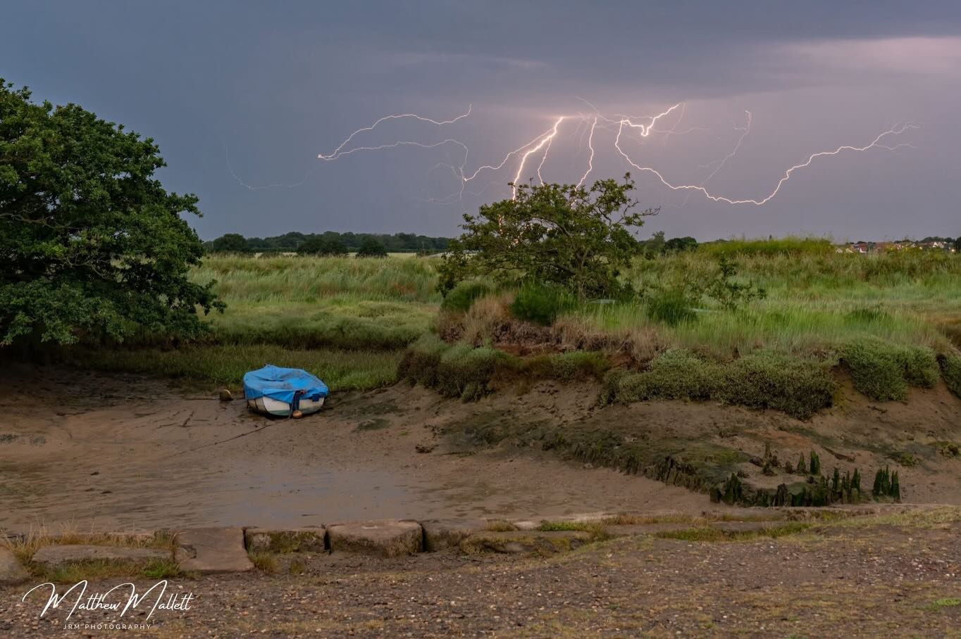 Cloud-to-cloud lightning over fields