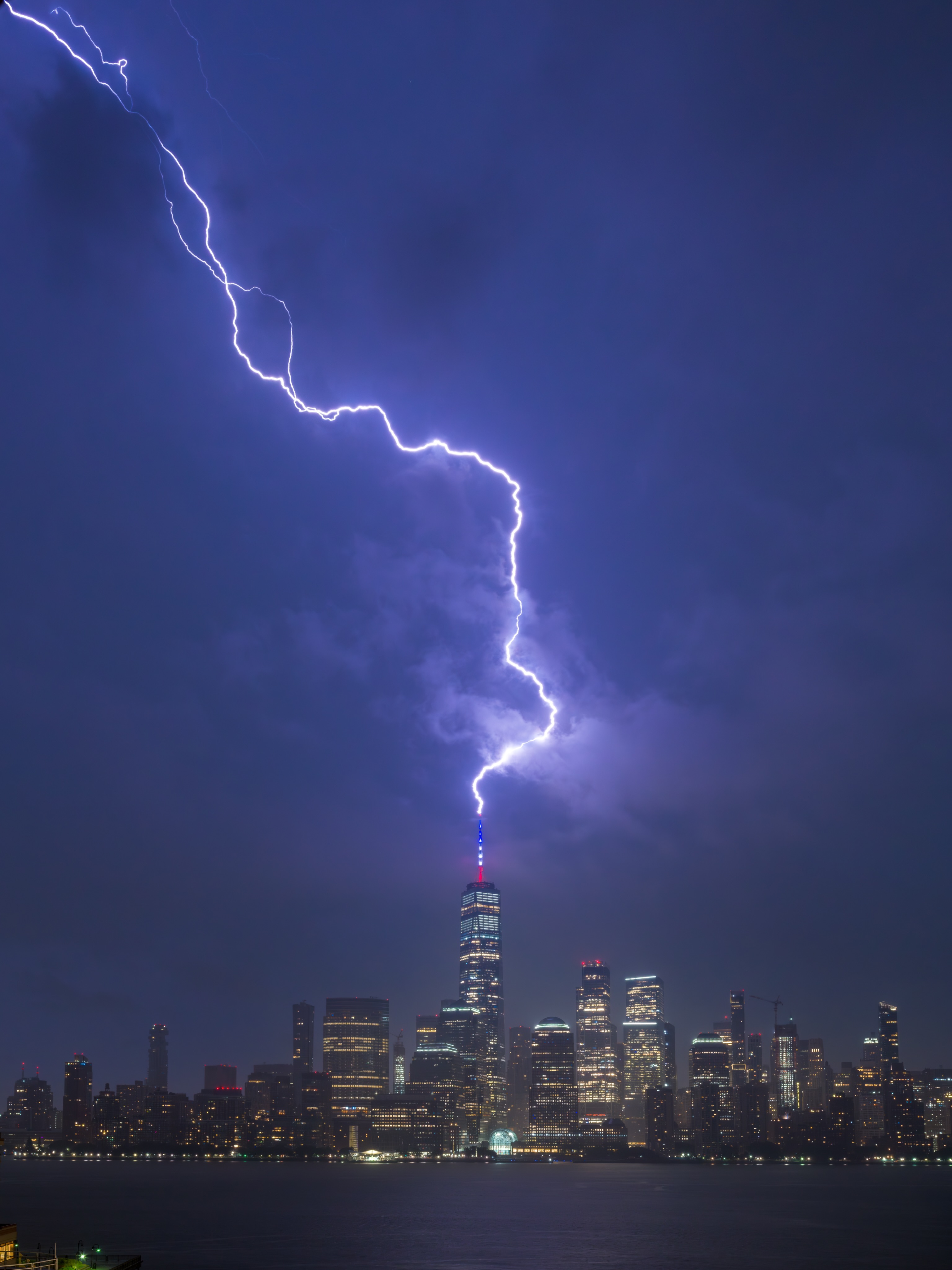 A bright lightning bolt striking One World Trade Center