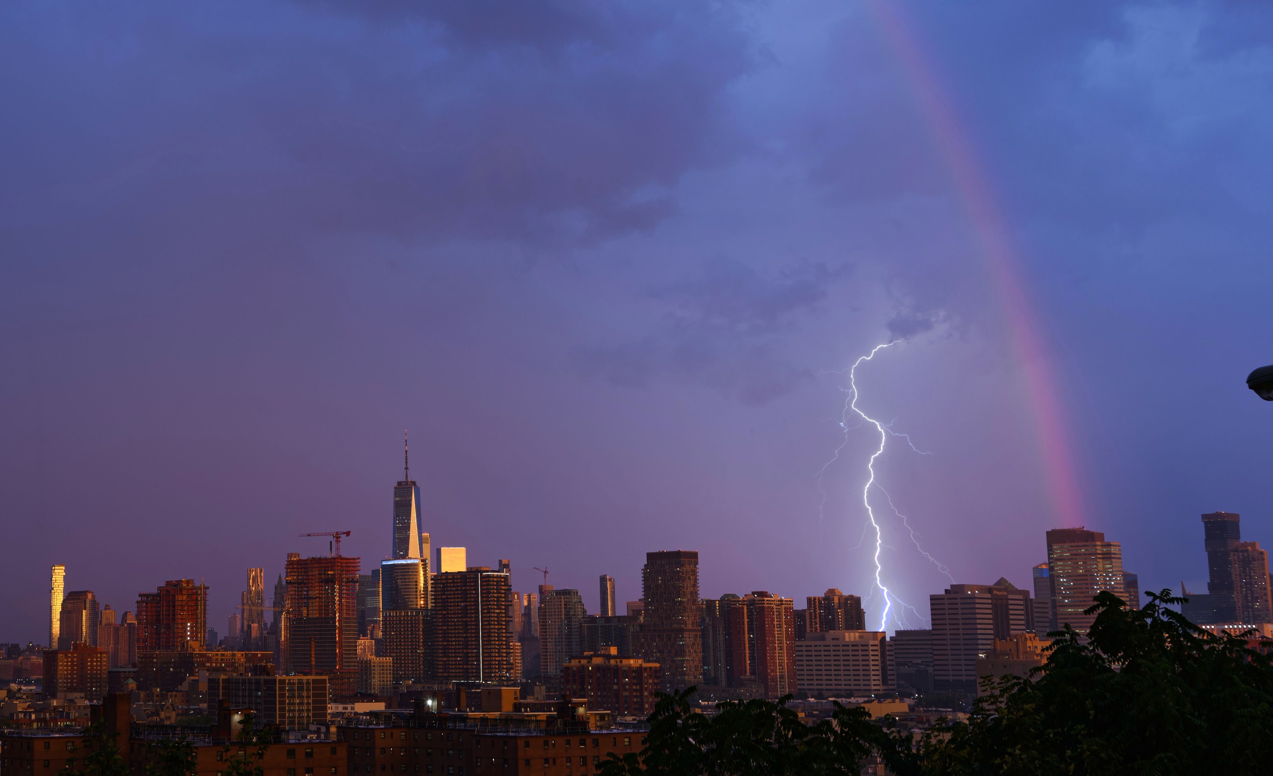 Lightning and a rainbow over the city