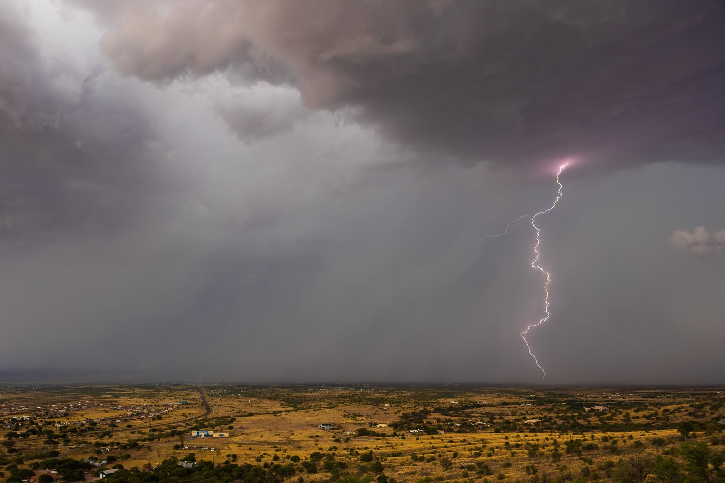 Lightning and rain over open desert