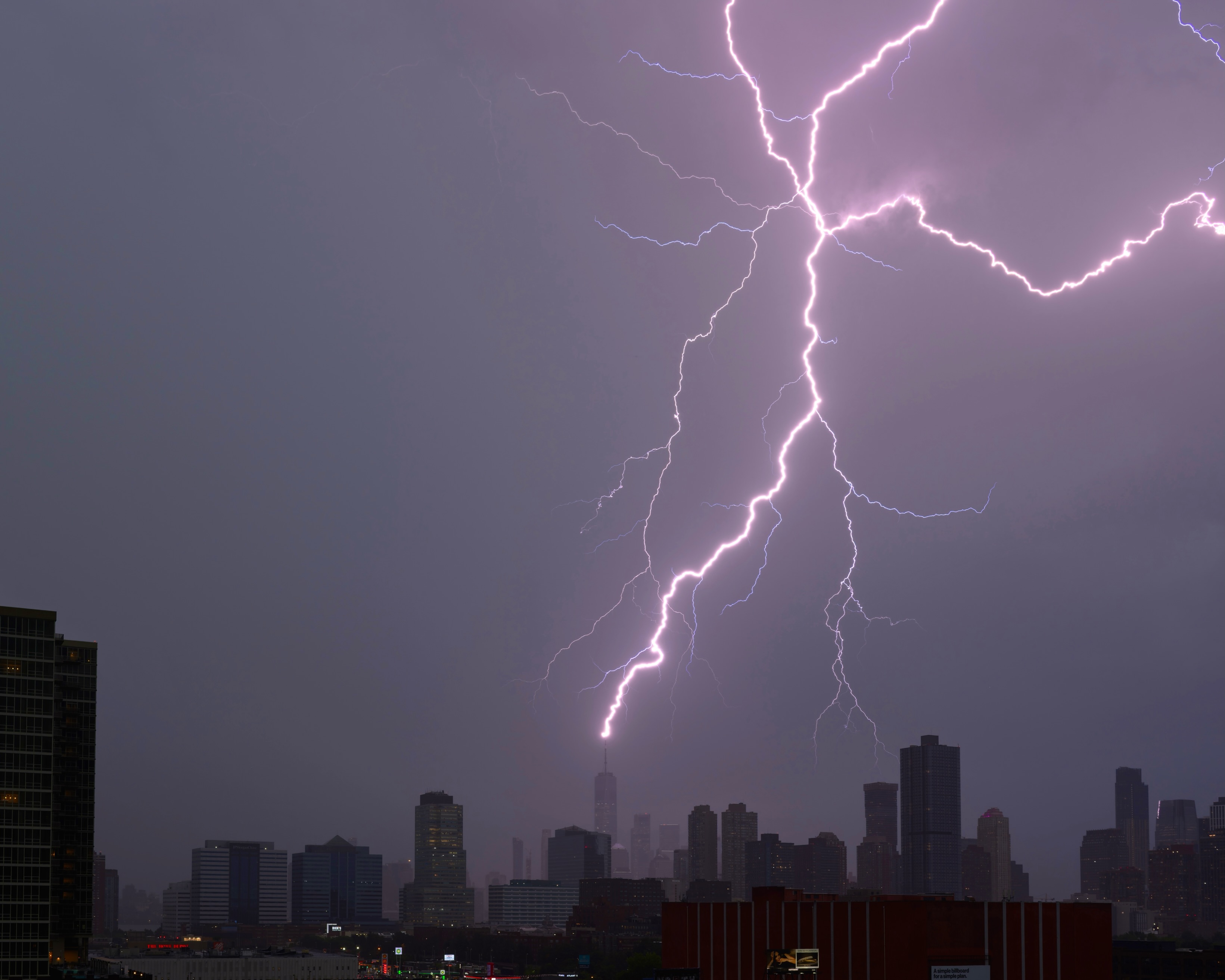 Lightning above city lights