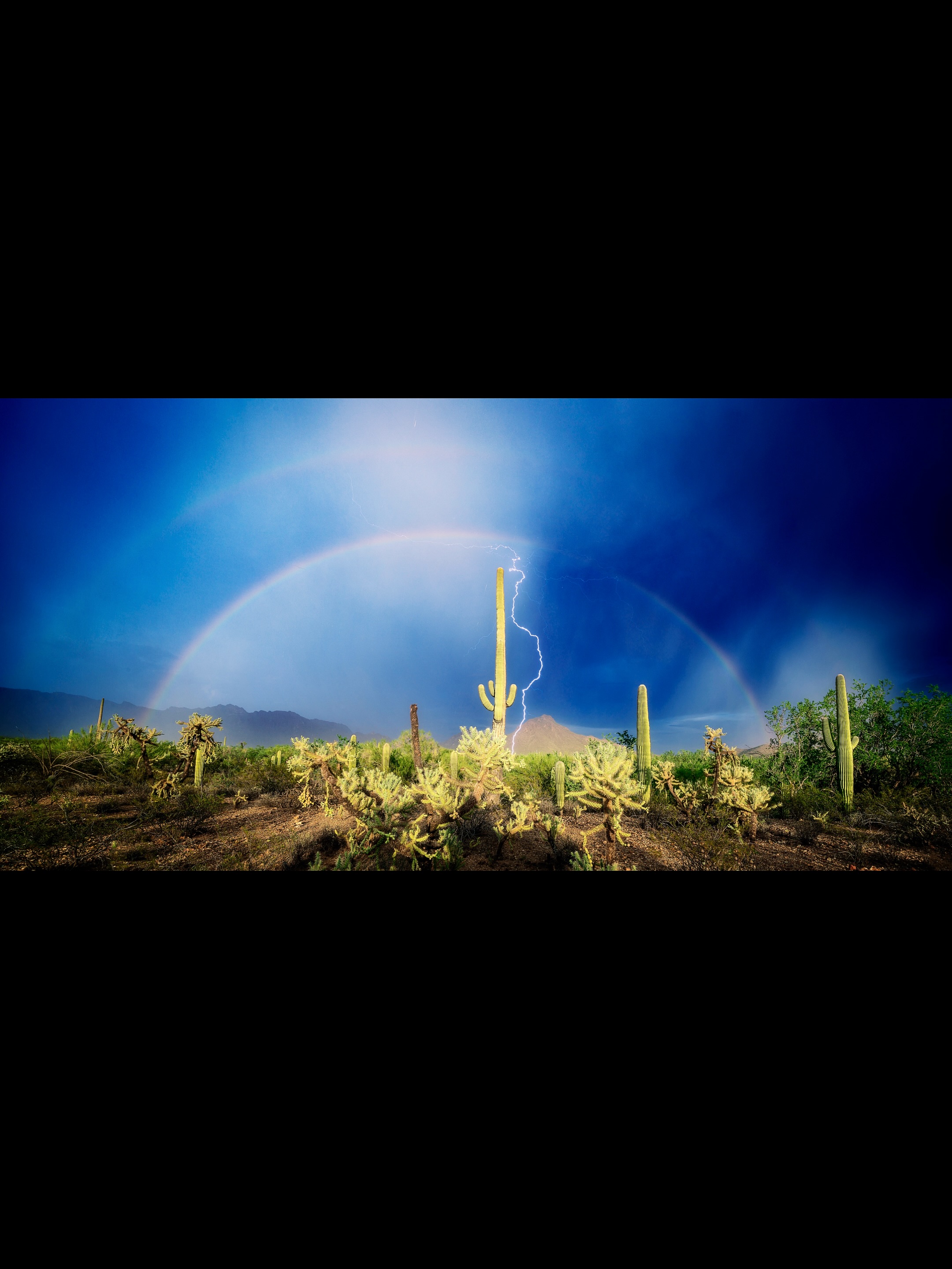 Double rainbow and lightning at Gates Pass